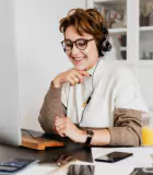 Professional Woman Engaged in a Virtual Meeting